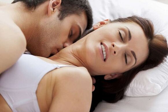 Tightened man and woman in bed